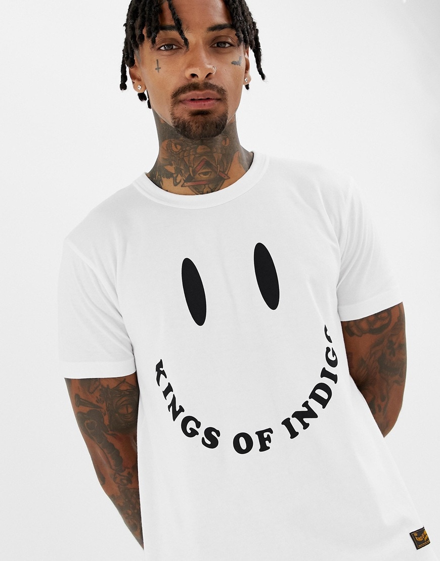 A picture of a model wearing a T-shirt with a smiling face print. Available at ASOS.