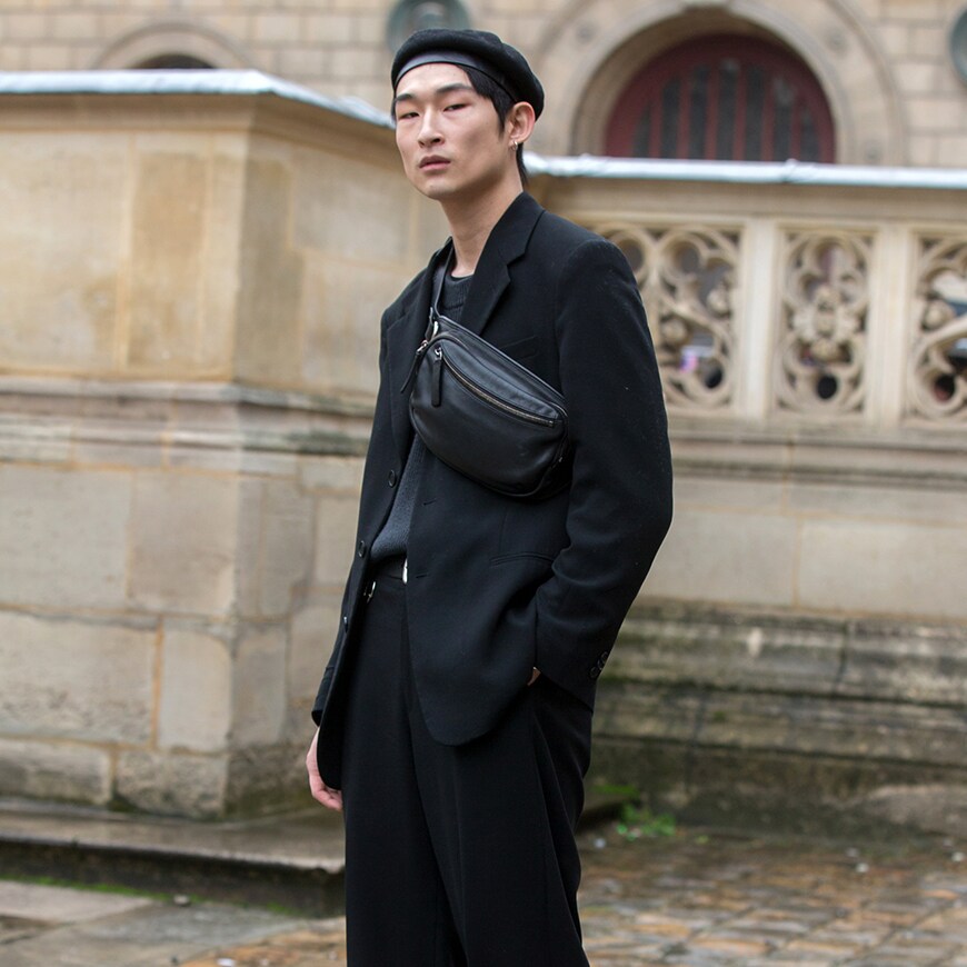 A street-styler wearing a black T-shirt and black suit | ASOS Style Feed