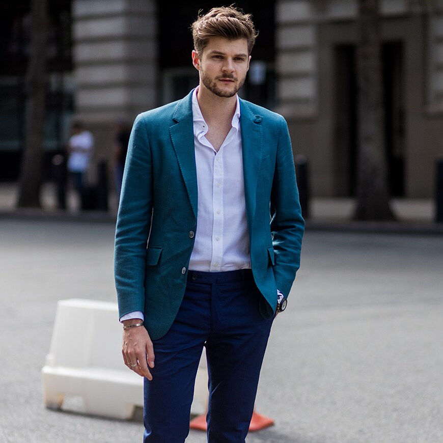 A street-styler wearing a white shirt, teal blazer and blue chinos | ASOS Style Feed