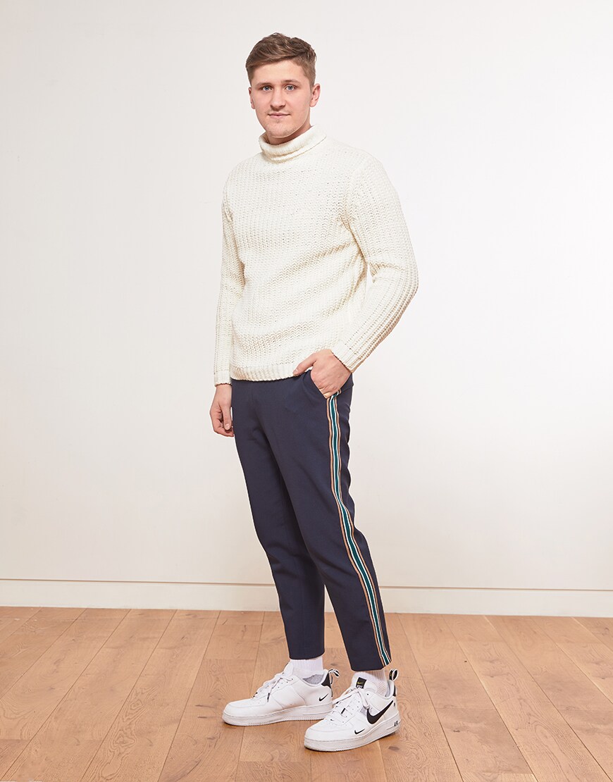 Seb wearing a roll-neck jumper, striped trousers and Air Force 1 trainers | ASOS Style Feed