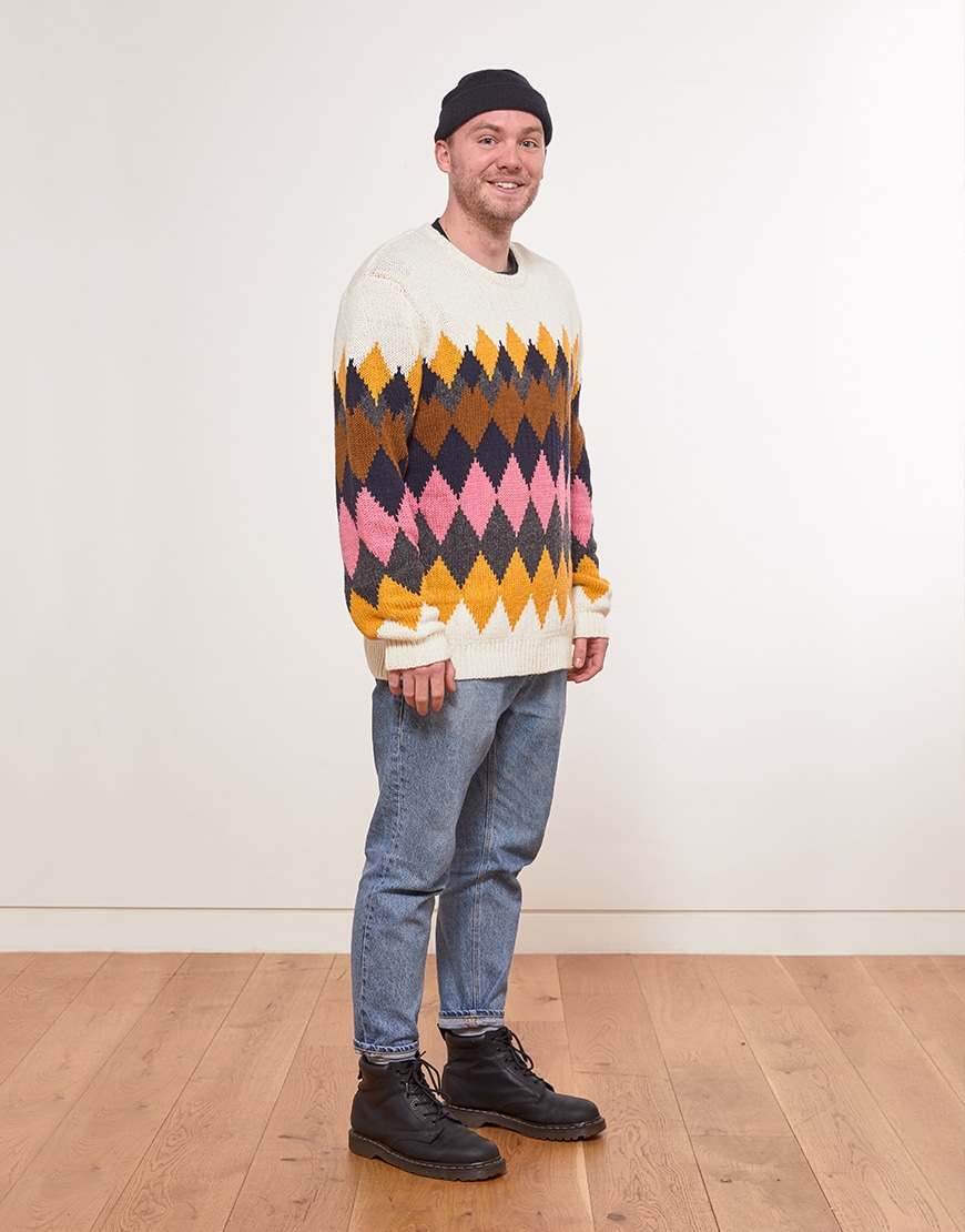 Steven wearing a knitted jumper, jeans, a beanie and lace-up boots | ASOS Style Feed