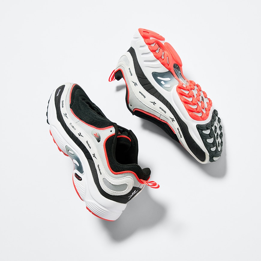 A picture of a pair of Reebok Daytona DMX trainers in black, white and red. Available at ASOS.