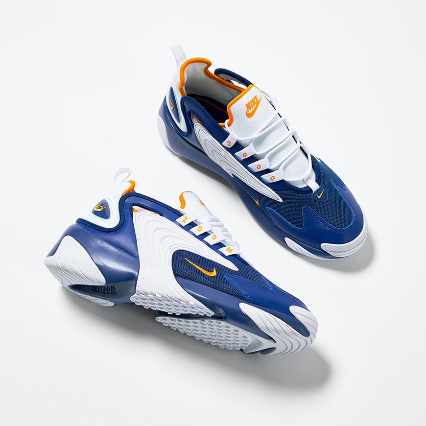 A picture of a pair of Nike Zoom 2K trainers in a white and blue colourway. Available at ASOS.