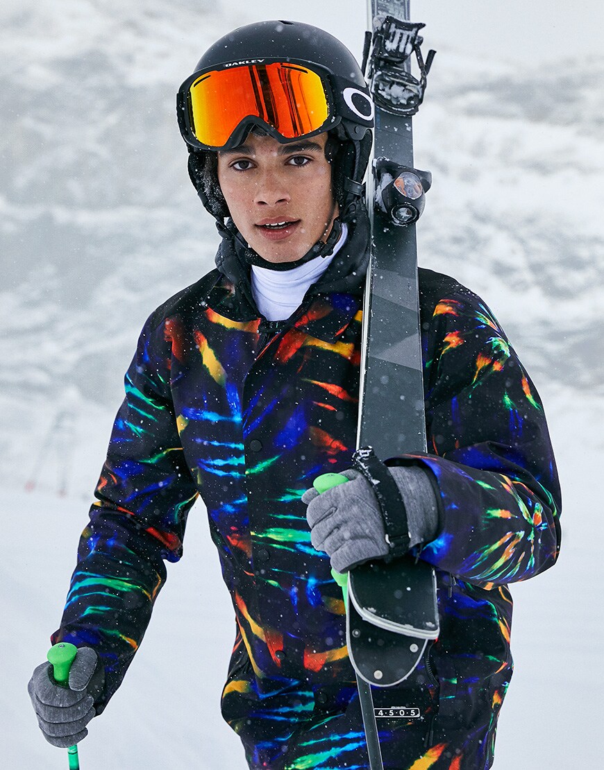 A picture of a man skiiing wearing a tie-dye ski suit by ASOS 4505. Available on ASOS.