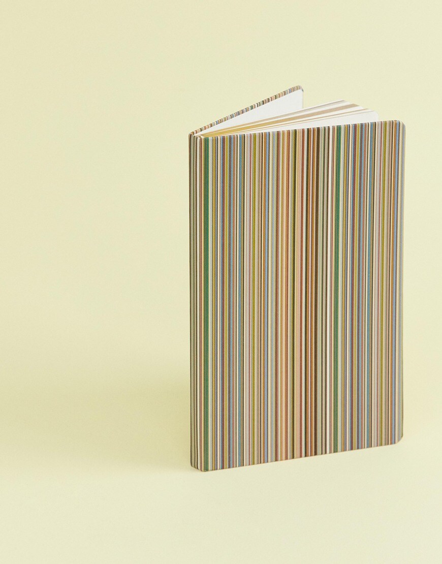 A picture of a Paul Smith notebook in a multicoloured stripe design. Available at ASOS.