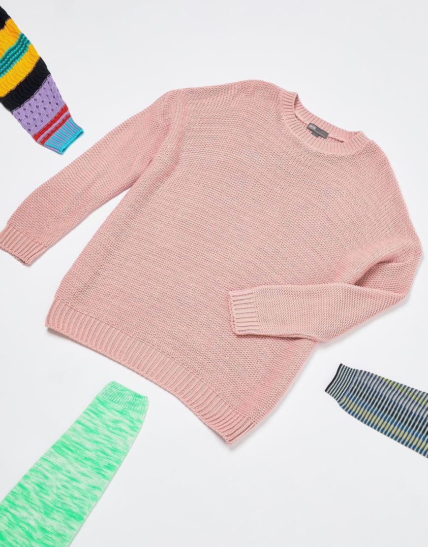 A picture of a men's knitted jumper in a plain pink colourway. Available on ASOS.
