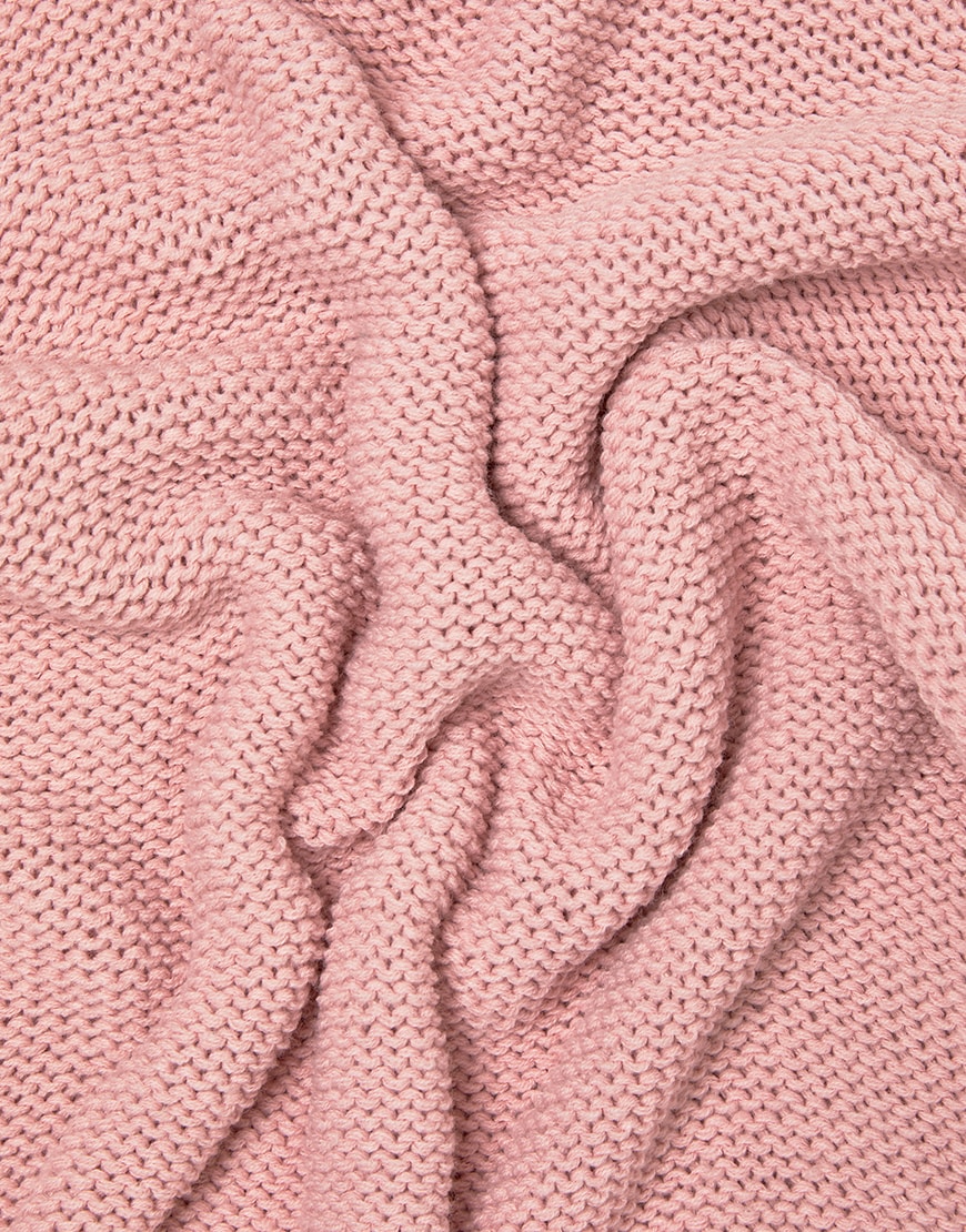 A close-up picture of a plain pink men's knitted jumper featuring a cross-hatch knit technique. Available on ASOS.