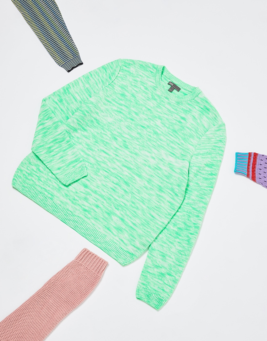A picture of a men's knitted jumper designed using a green and white mixed-knit effect. Available on ASOS.