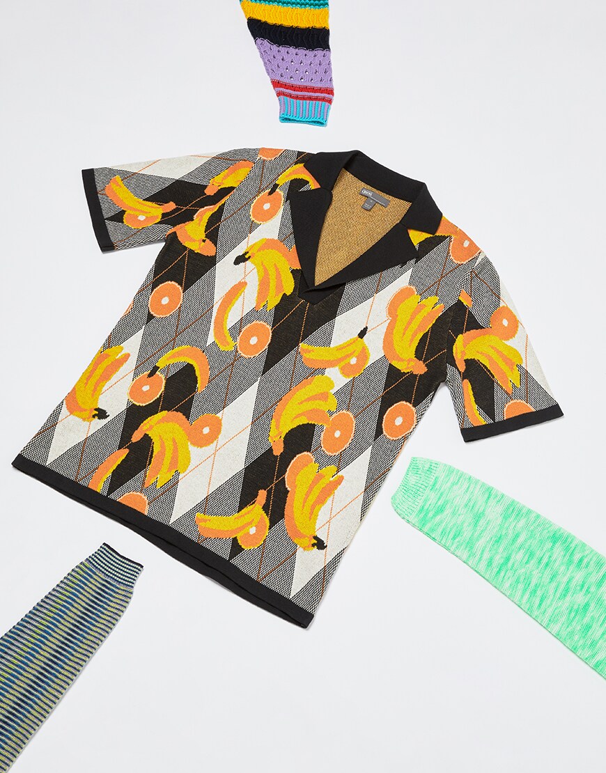 A picture of a short sleeve knitted top featruing a mixed diamond and fruit design. The top also has a revere-style collar, Available on ASOS.