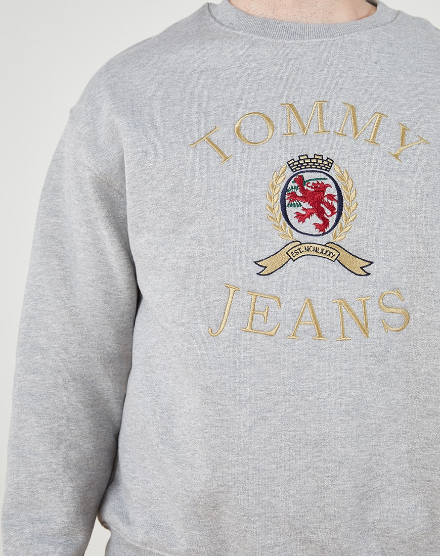 A close up of a Tommy Jeans sweatshirt with embroidered branding. Available on ASOS.