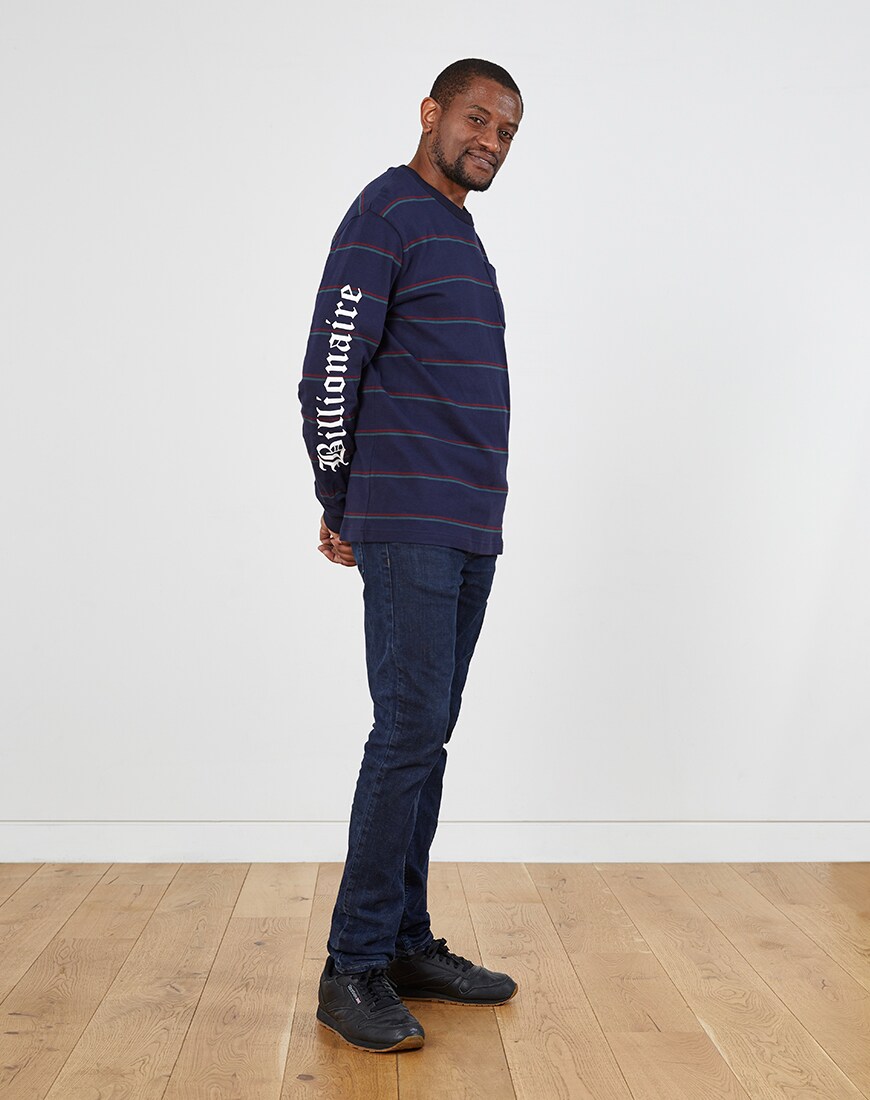 A picture of a man wearing a long sleeve striped T-shirt from Billionaire Boys Club. Available at ASOS.
