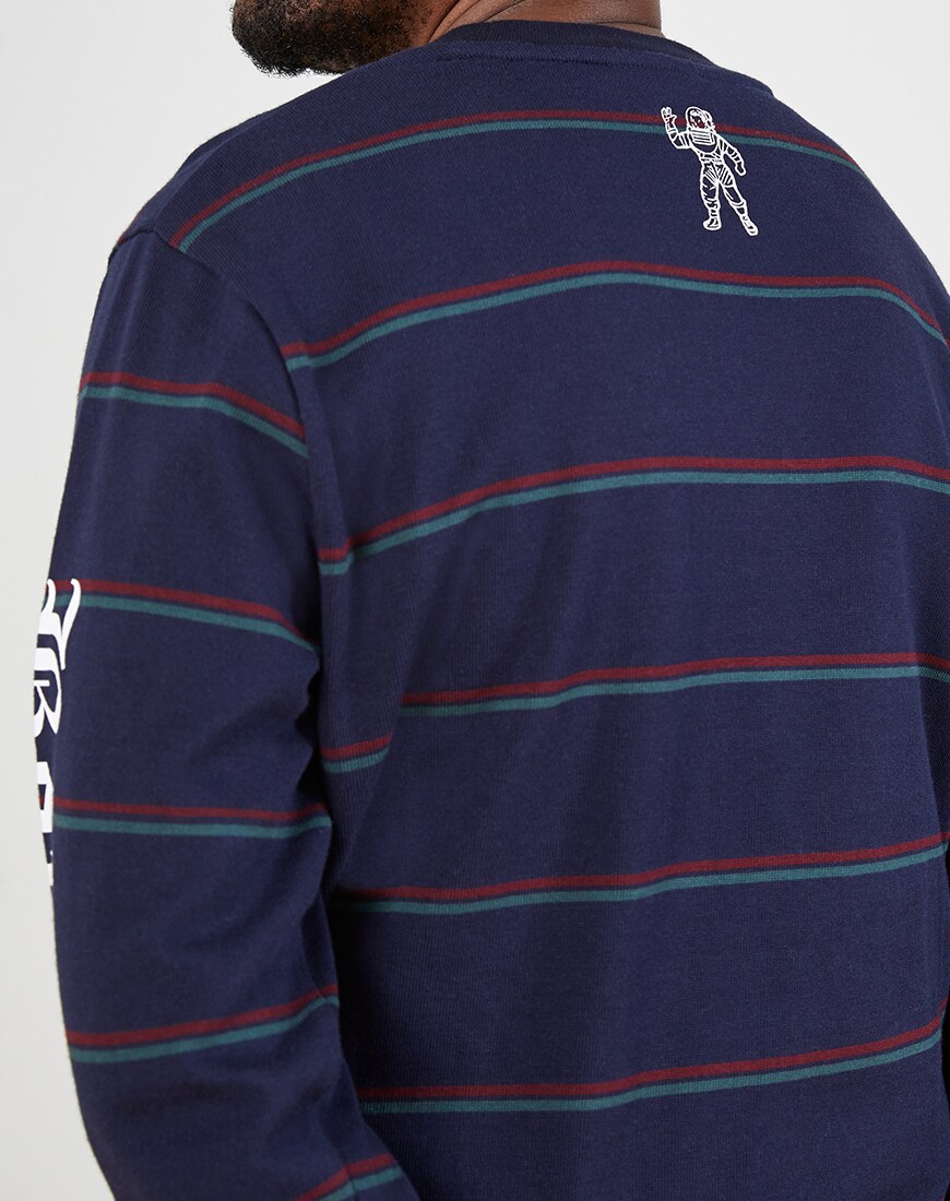 A close up picture of a man wearing a striped long sleeve t-shirt by Billionaire Boys Club, available at ASOS.