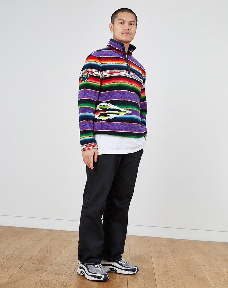 A picture of a man wearing a multicoloured fleece from Polo Ralph Lauren. Available at ASOS.