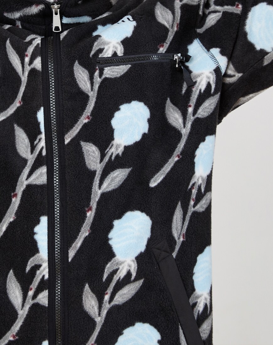 A close up picture of a floral print fleece tracksuit. Available at ASOS.