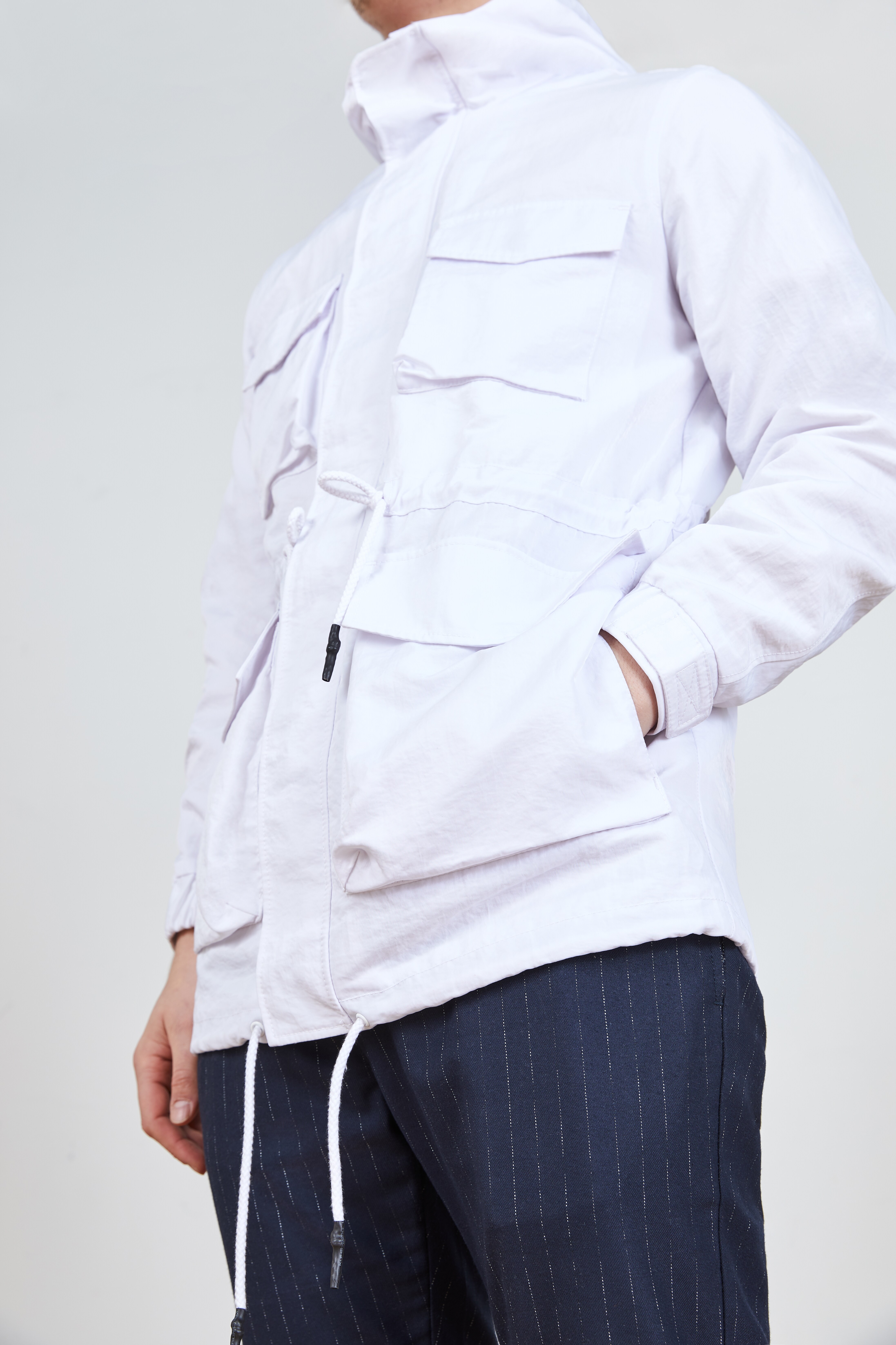 A close up picture of a white utility jacket. Available on ASOS.