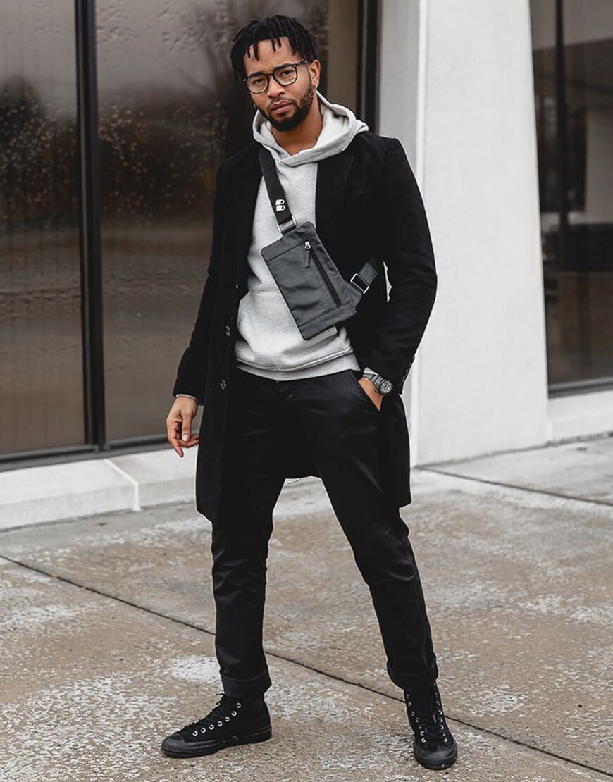 ASOS Insider Luce wearing a grey hoodie, black jeans, black coat and black Converse | ASOS Style Feed