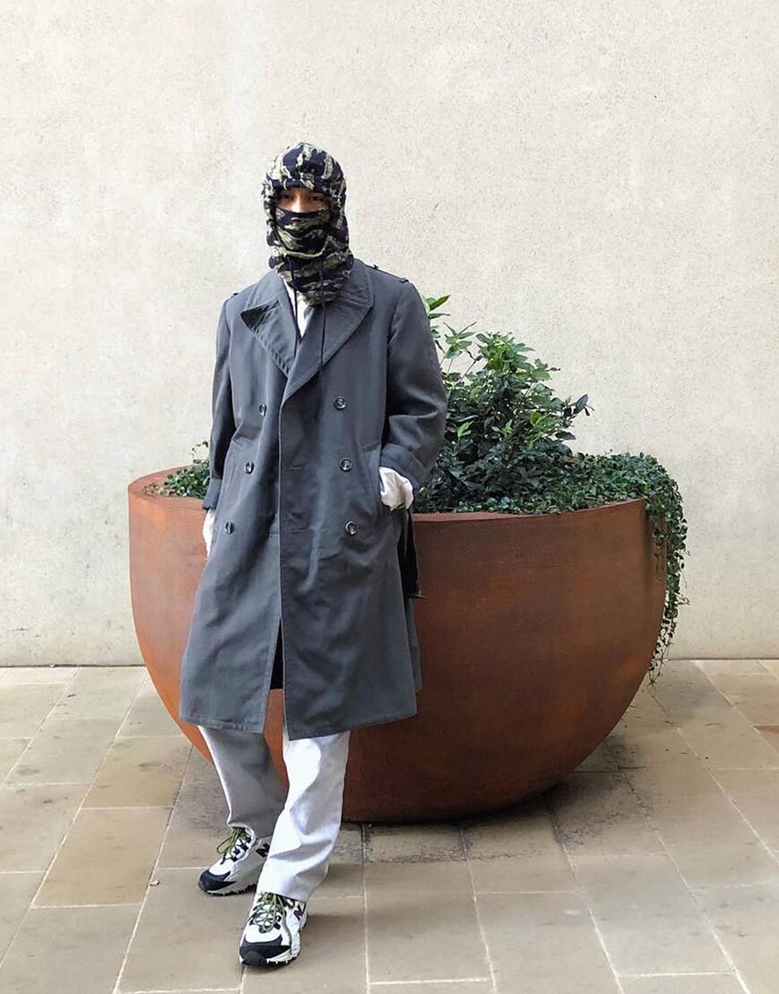 ASOS Insider Nawal wearing a snow hood, white shirt, grey mac coat, white jeans and New Balance trainers | ASOS Style Feed