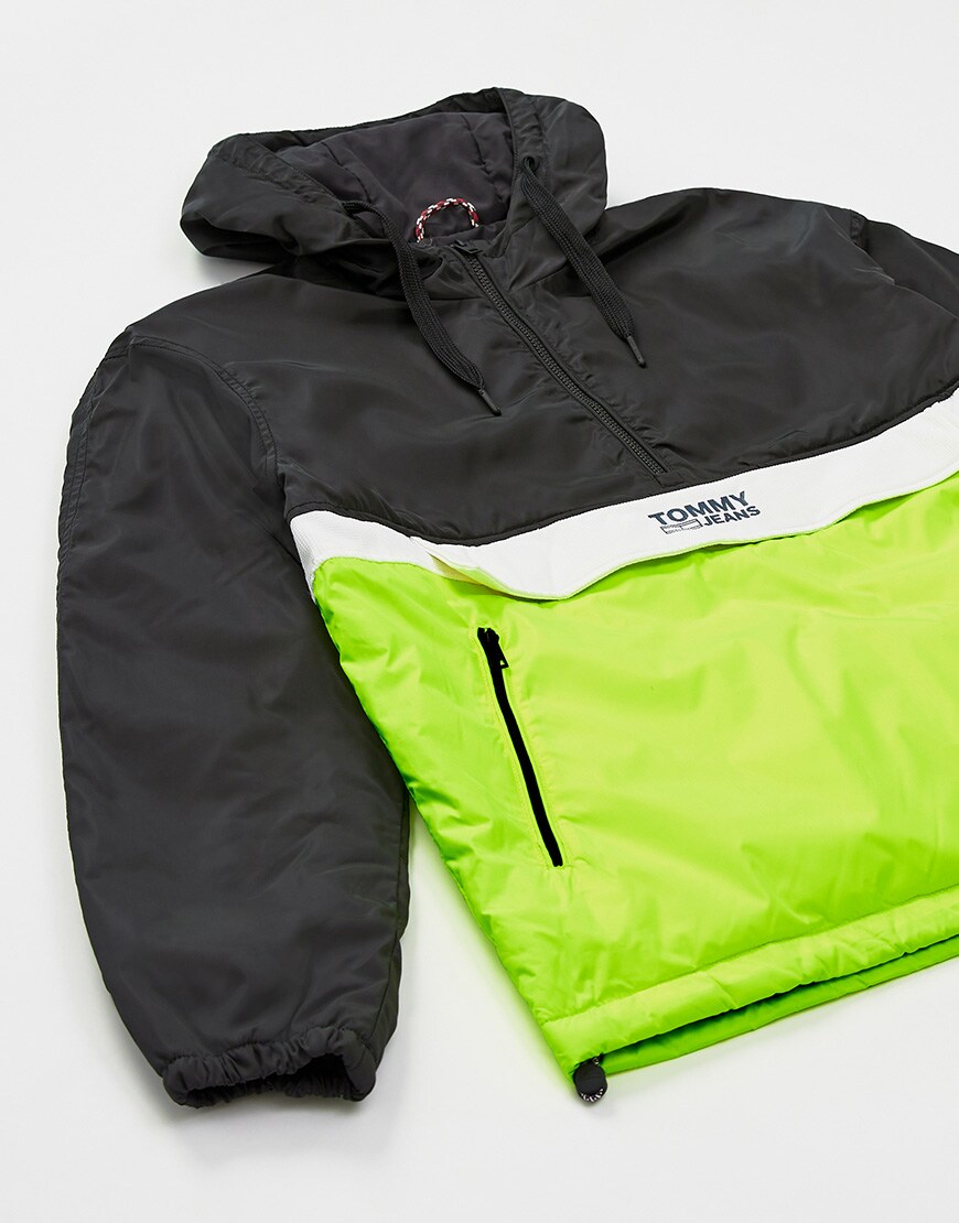 A close-up picture of a black and green windbreaker by Tommy Jeans. Available at ASOS.