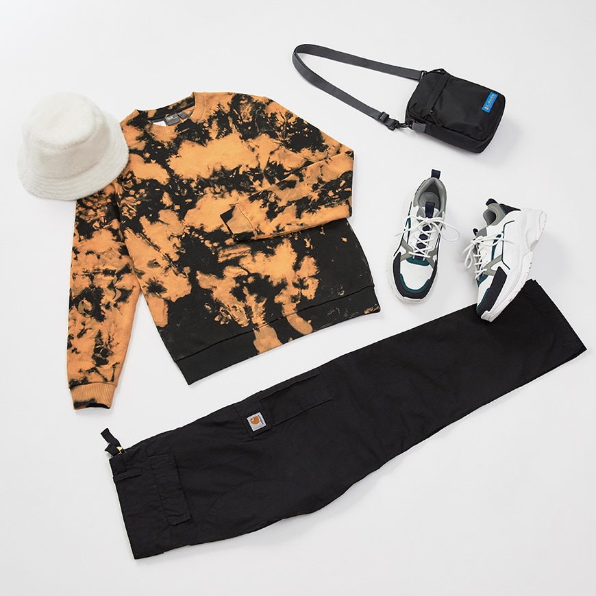 A flat lay of a mate-night outfit including a sweatshirt and trousers, trainers and accessories. Available at ASOS.