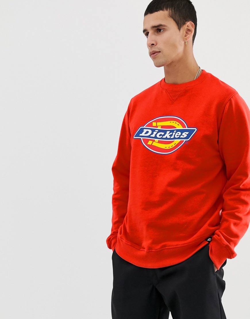 A picture of a man wearing a red Dickies sweatshirt. Available at ASOS.