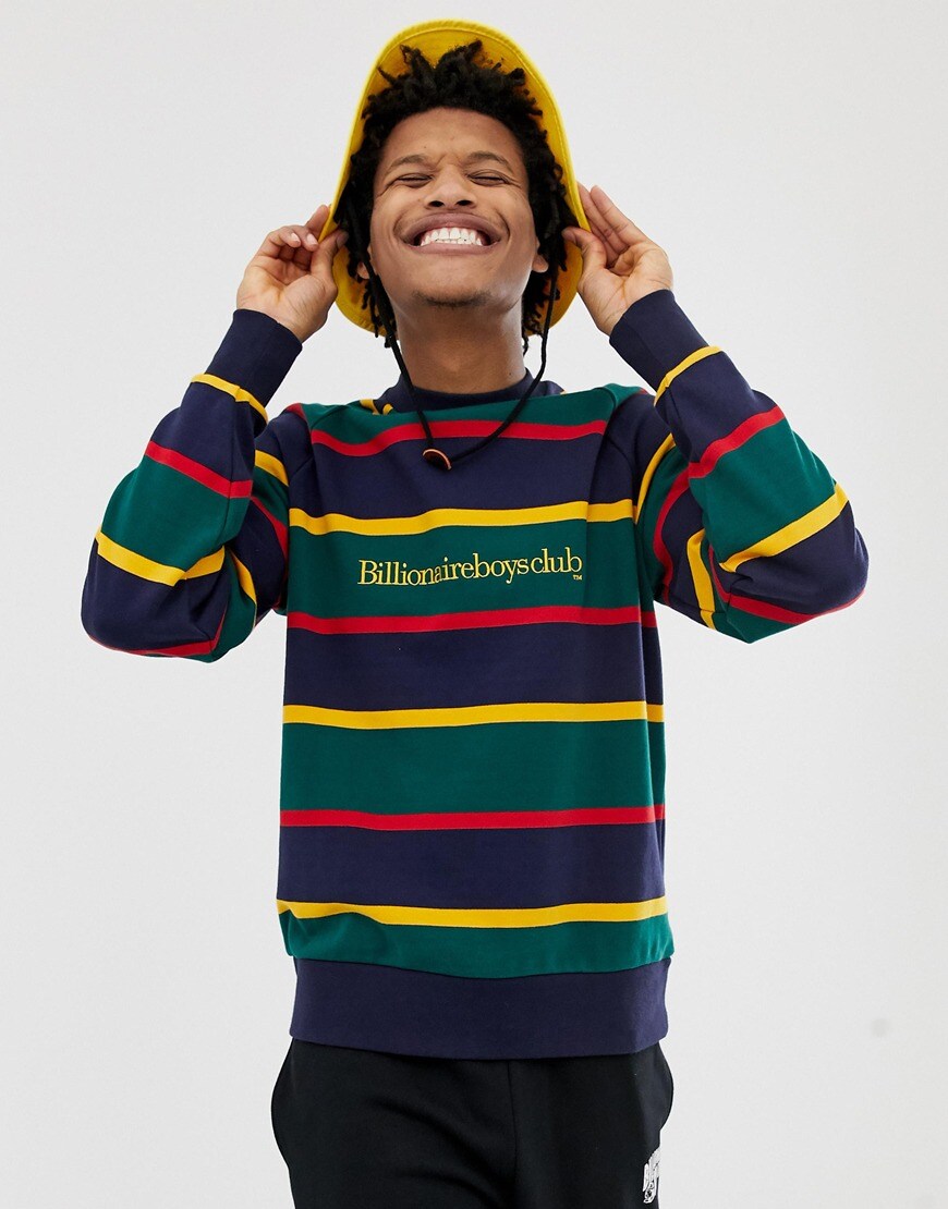 A picture of a man wearing a multi-colour stripe sweatshirt from Billionaire Boys Club. Available at ASOS.
