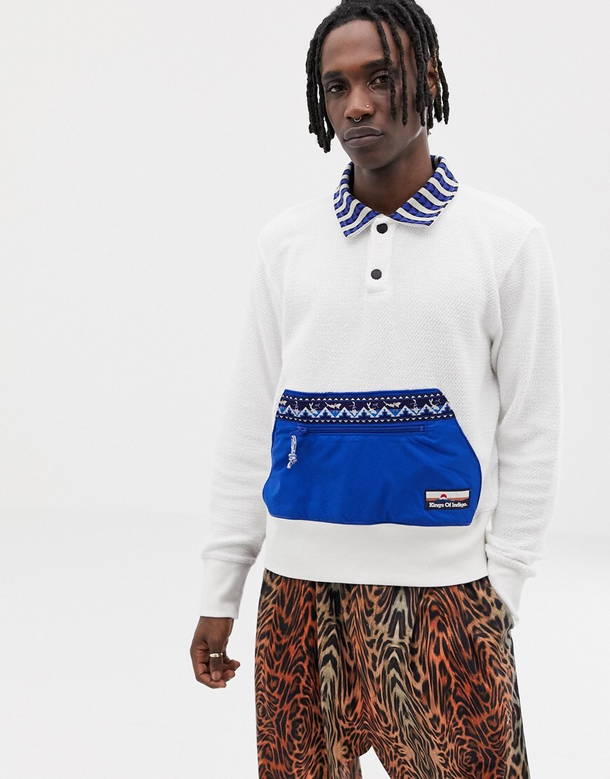 A picture of a man wearing a white sweatshirt by Kings Of Indigo. Available at ASOS.