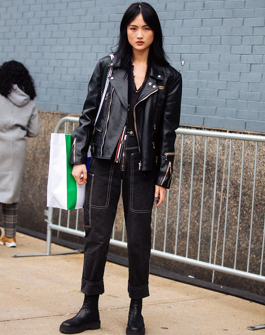 A picture of a street styler wearing a leather biker jacket.