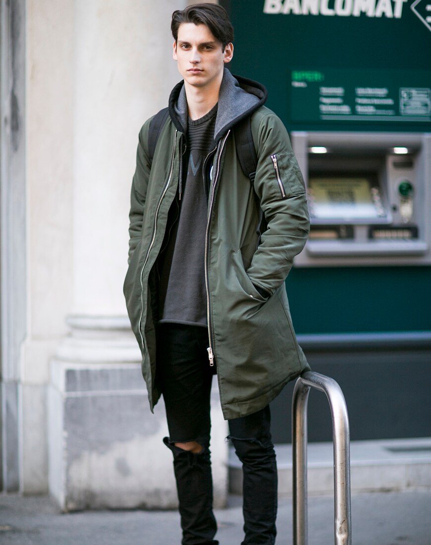 A picture of a street styler in a layered outfit.