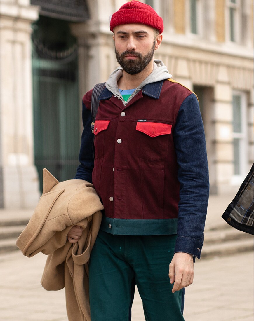 A picture of a street styler in a colour-blocked outfit.