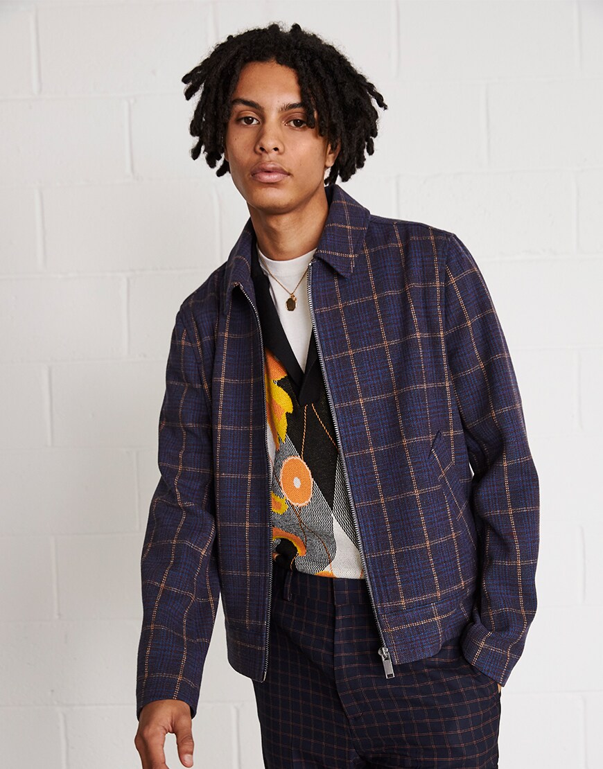 A picture of a man wearing a vibrant short-sleeve jumper. Available at ASOS.