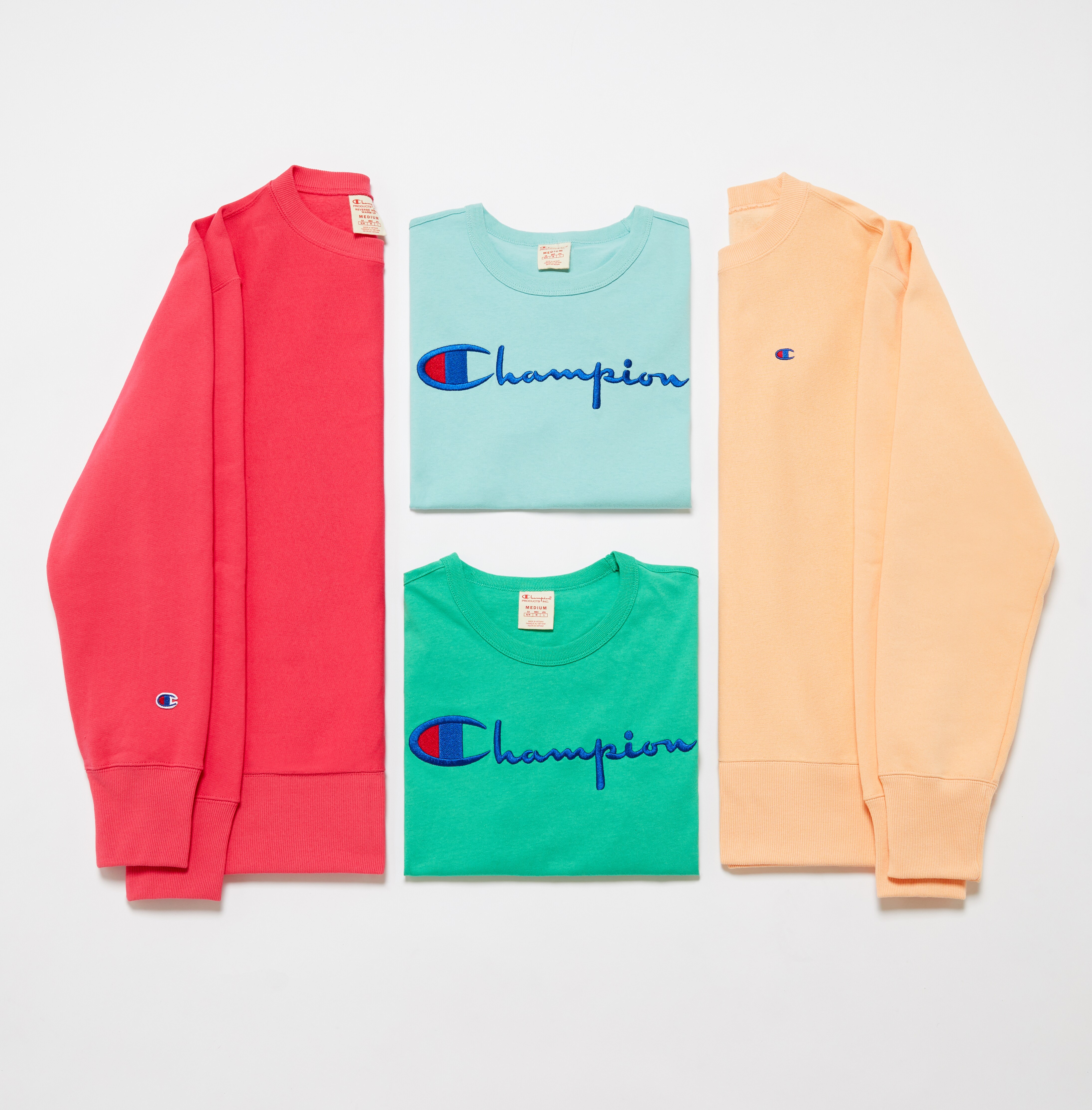 A picture of four colourful sweatshirts from Champion. Available on ASOS.