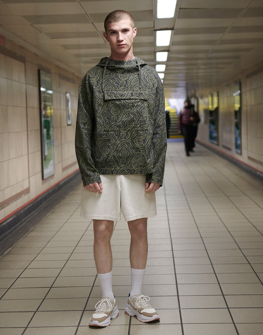 A picture of a man wearing an ASOS DESIGN outfit. Available on ASOS.