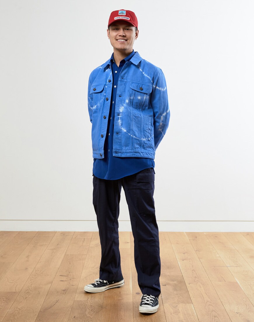 A picture of a man wearing a blue tie-dye denim jacket. Available at ASOS.