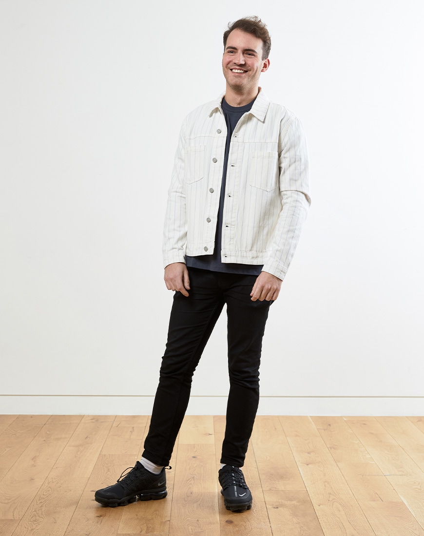 A picture of a man wearing a white denim jacket with pinstripes. Available at ASOS.