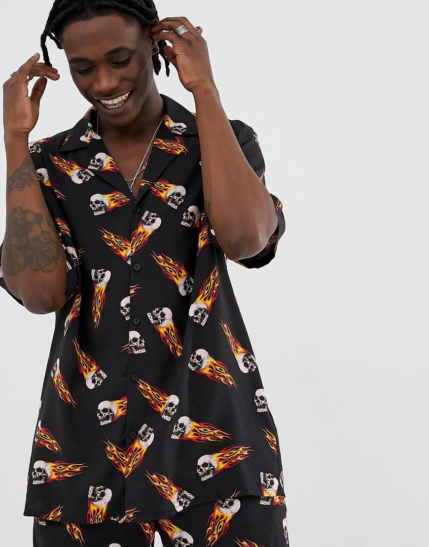 A picture of a man wearing a shirt featuring a flaming-skull print. Available at ASOS.