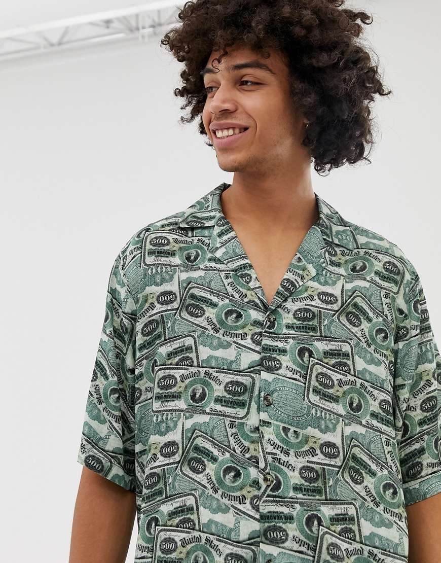 A picture of a man wearing a shirt featuring an all-over money print. Available at ASOS.