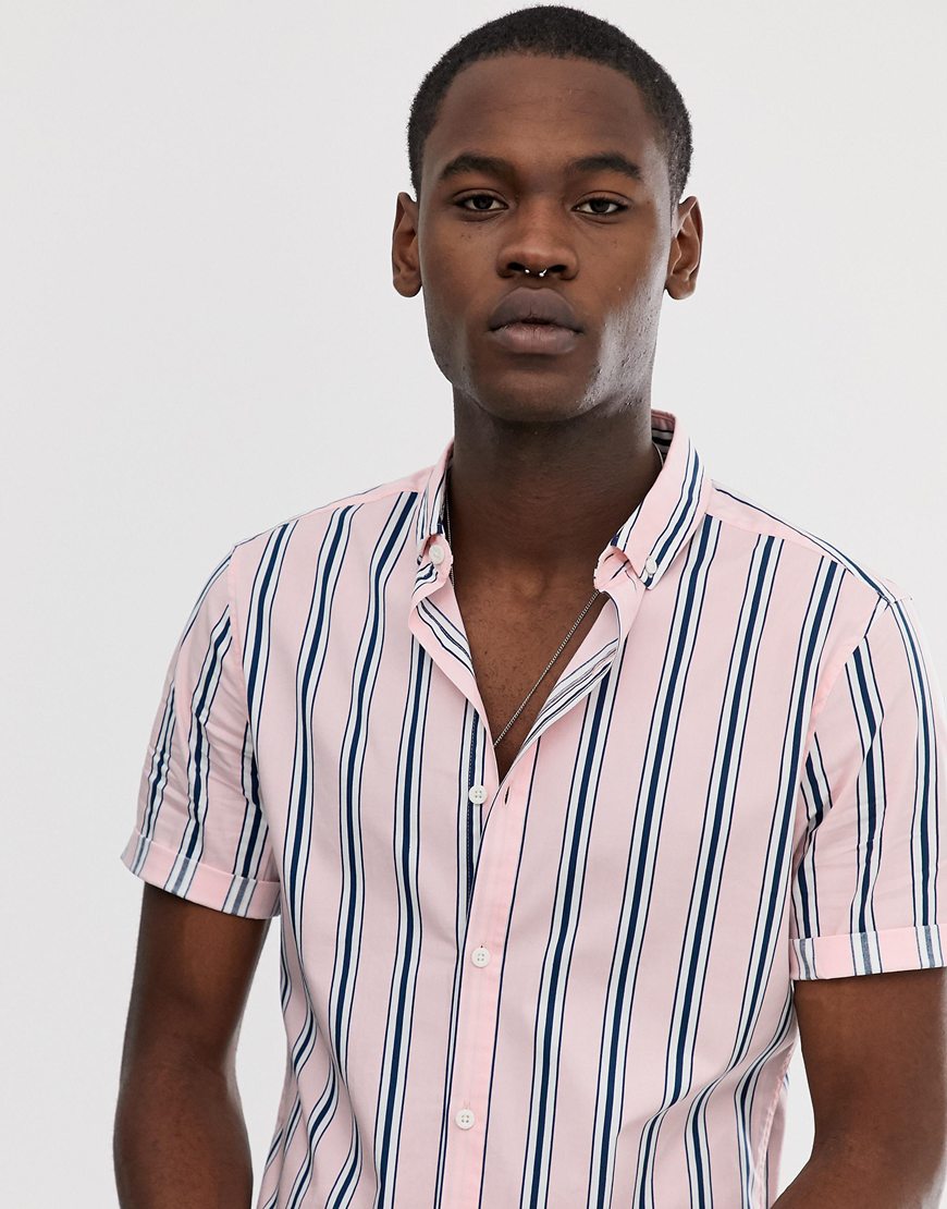 A picture of a man wearing a Tall pink striped shirt. Available at ASOS.