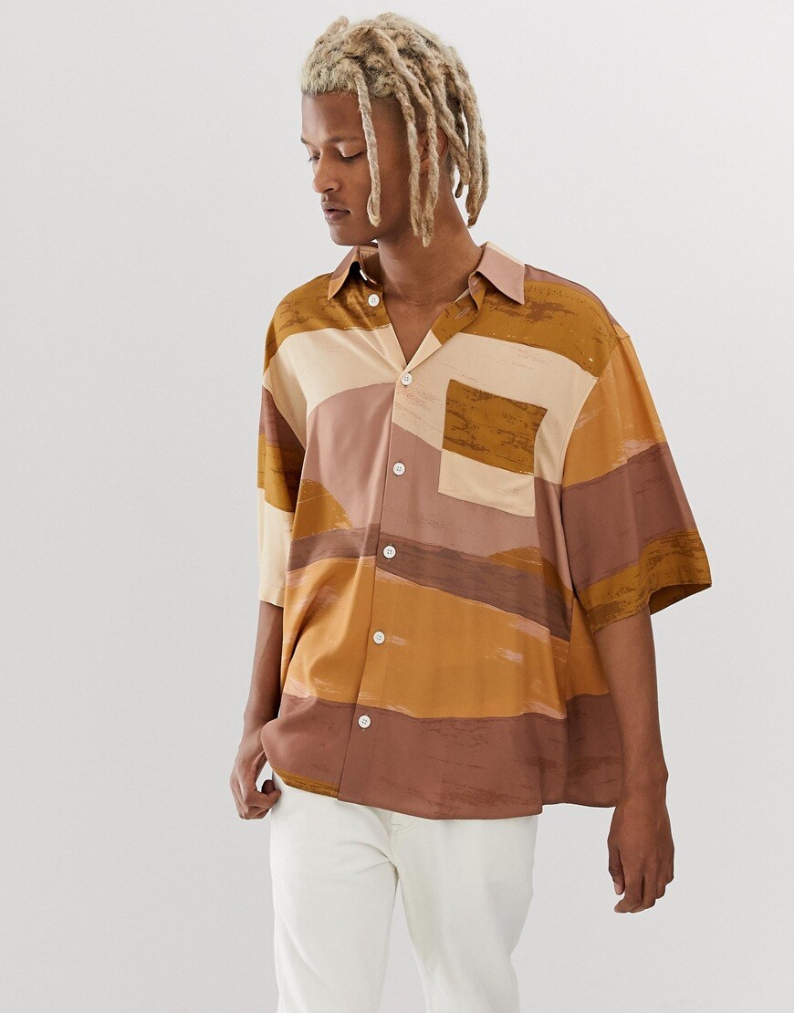 A picture of a man wearing an abstract print shirt. Available at ASOS.