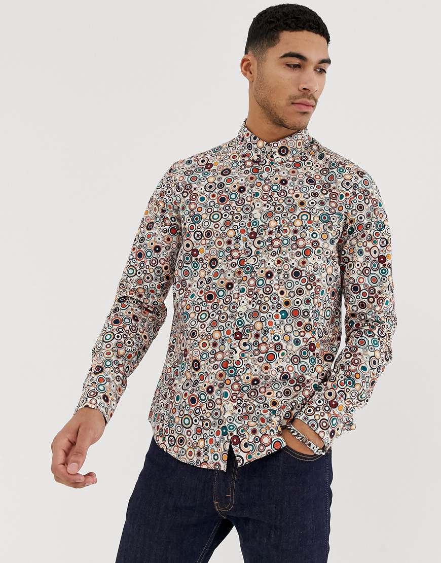 A picture of a man wearing an all-over print shirt by Pretty Green, available at ASOS.