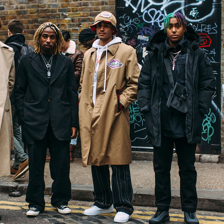 A picture of three street stylers during London Fashion Week.