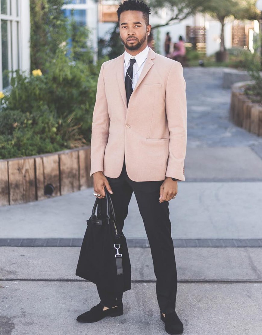 ASOS Insider Luce wearing a pink suit jacket and black suit trousers | ASOS Style Feed