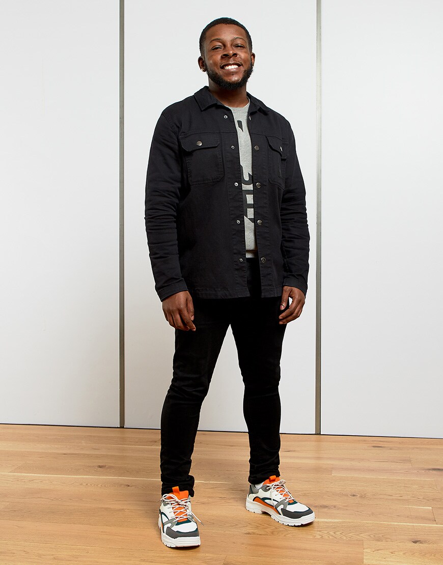 A picture of a man wearing a pair of chunky trainers. Available at ASOS.