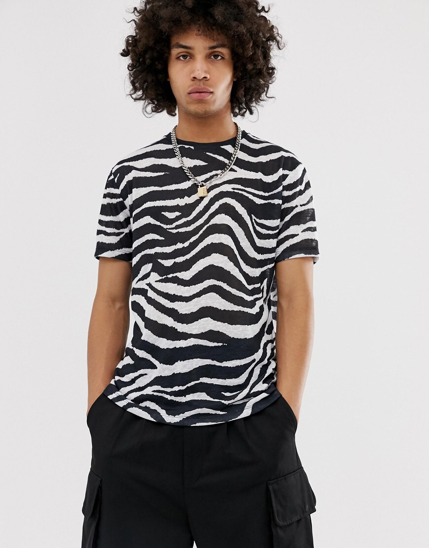 A picture of a model wearing a zebra-striped T-shirt. Available at ASOS.