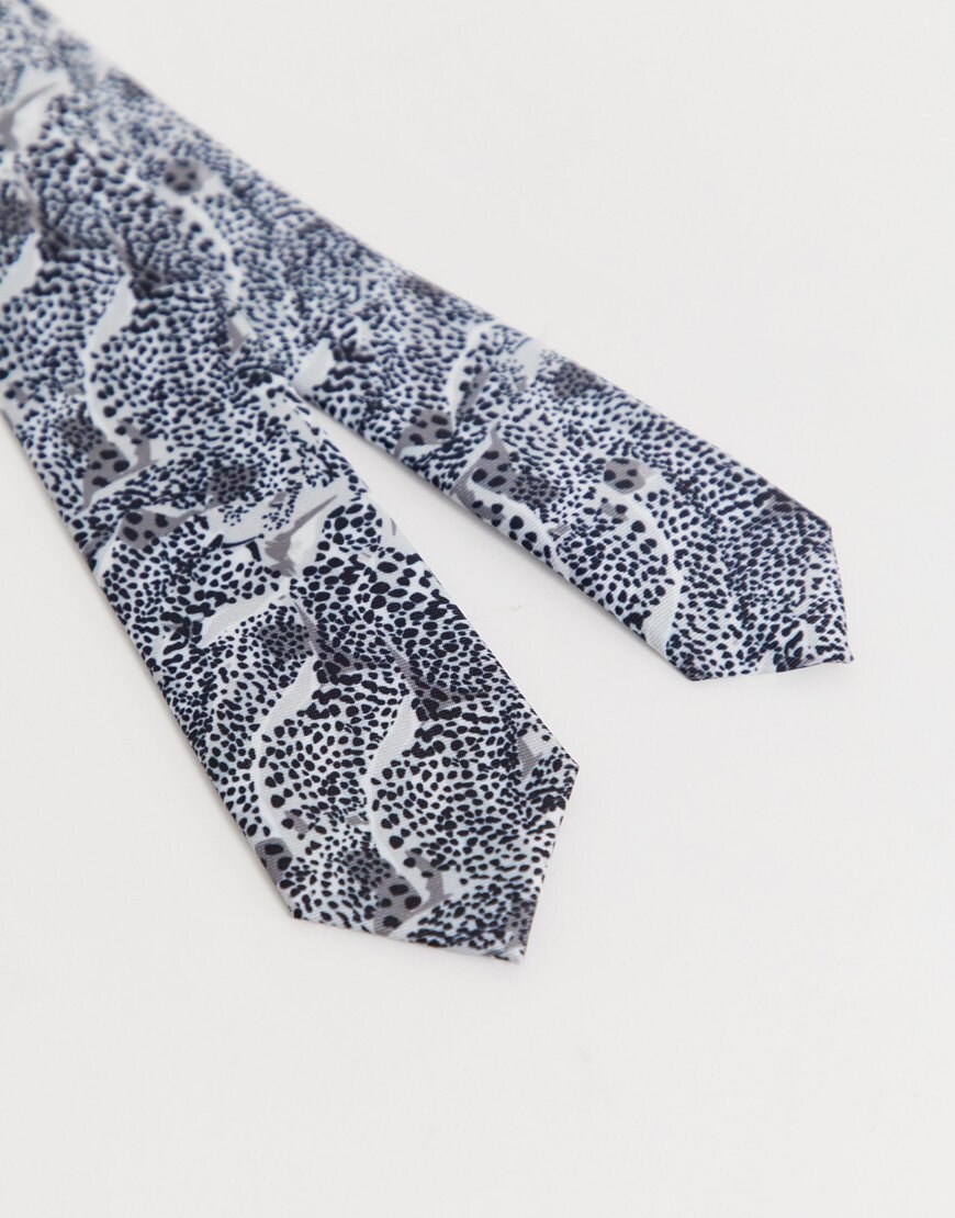A picture of a black and white leopard print tie. Available at ASOS.