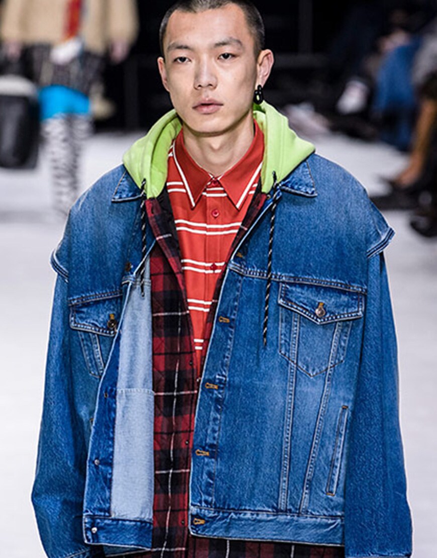 A picture of a model wearing a denim jacket.