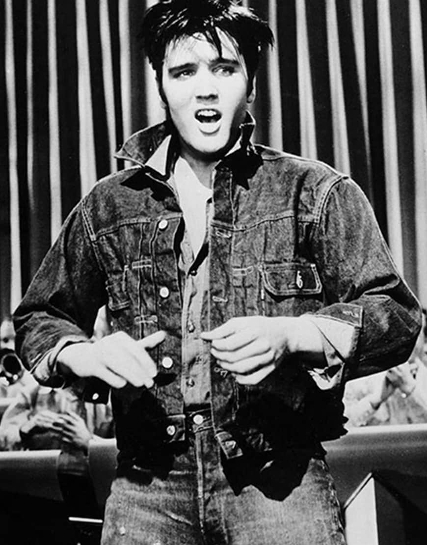 A picture of Elvis Presley wearing a denim jacket.