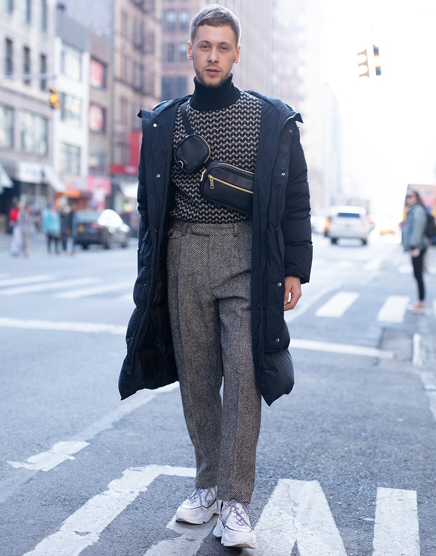 A picture of a street styler wearing a roll-neck jumper.