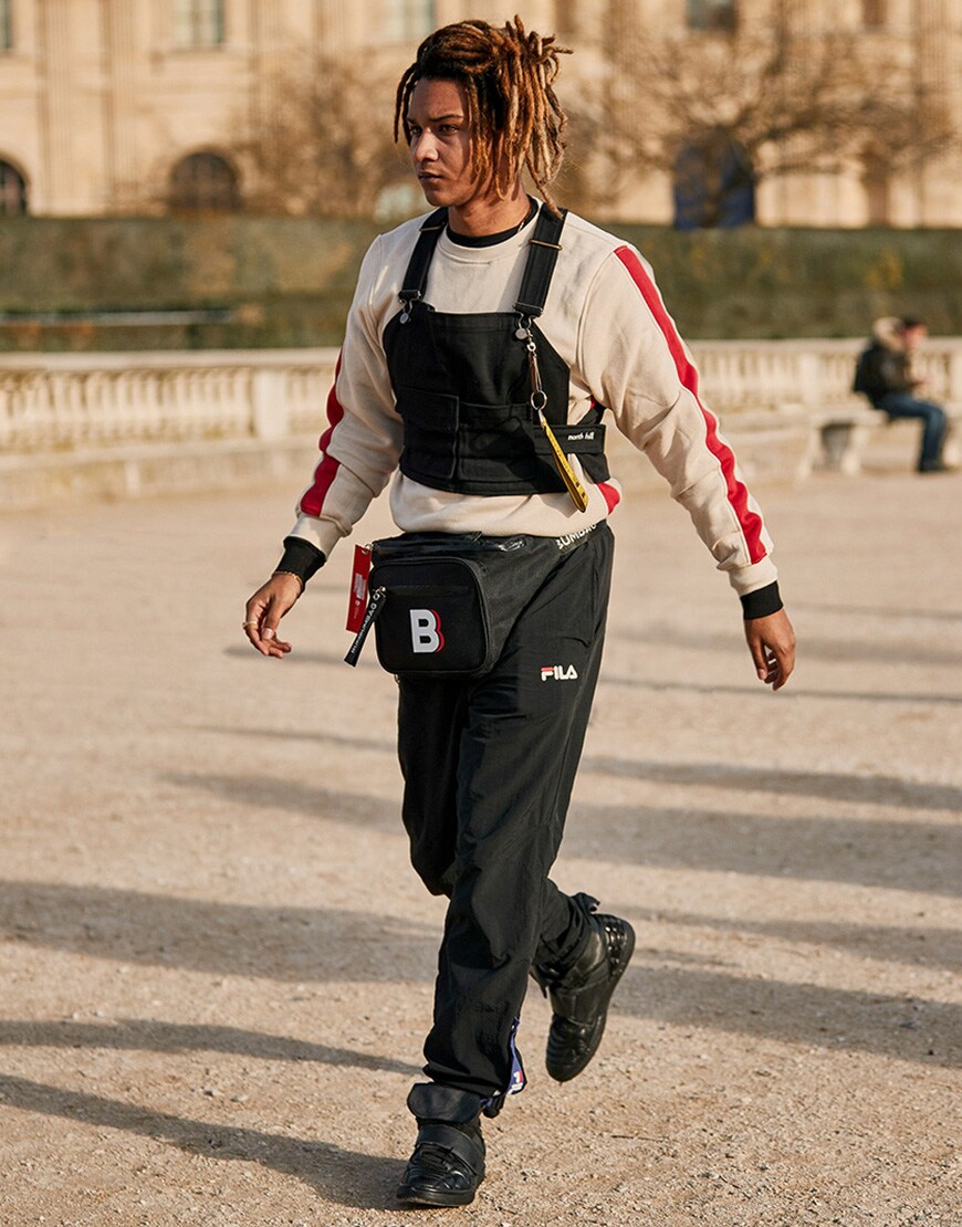 A picture of a street styler wearing a chest rig and bum bag.