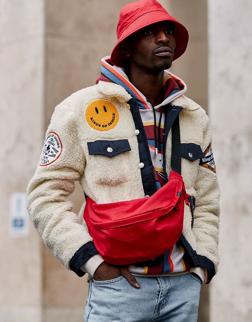 A picture of a street styler wearing a borg jacket.