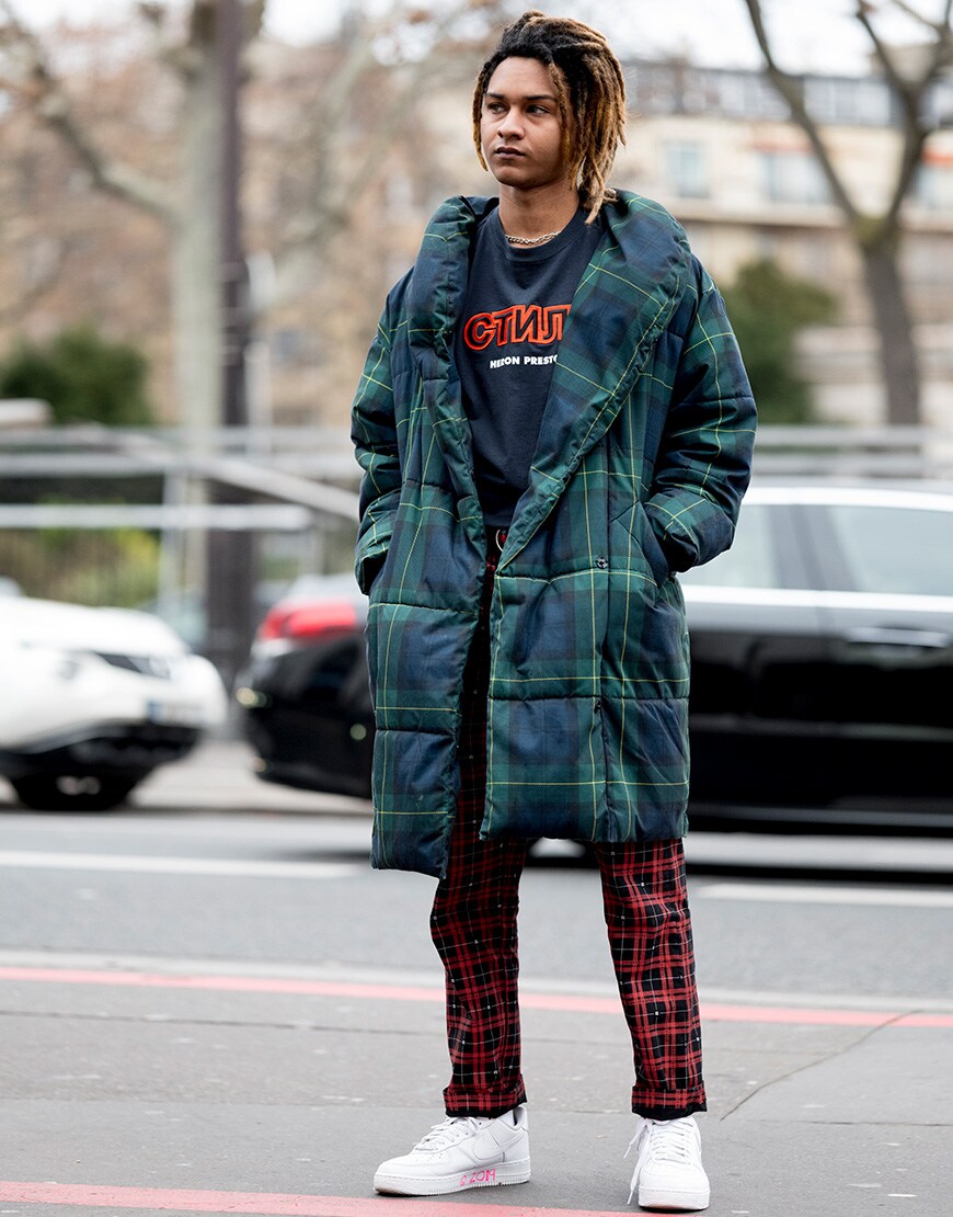 A street styler wearing a longline puffer jacket.